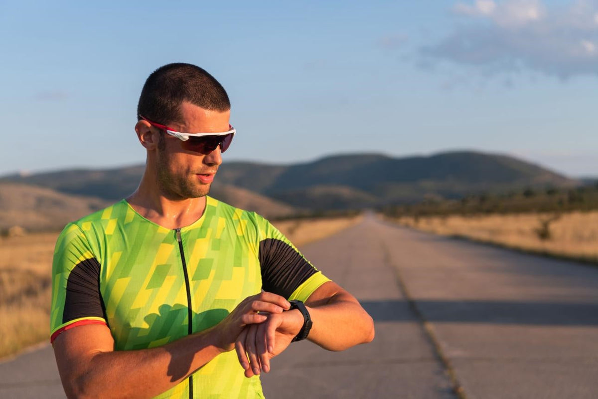  Triathlete using heart rate training to monitor intensity and improve endurance performance during a training session.