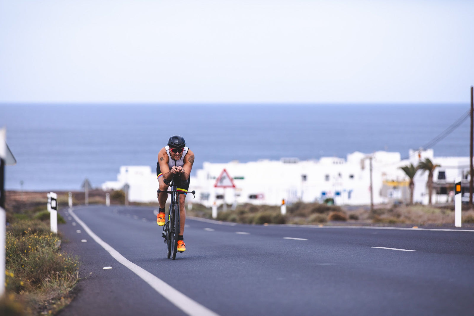 Triathlete competing during the bike leg of a triathlon, demonstrating one of the three disciplines that make up the sport.