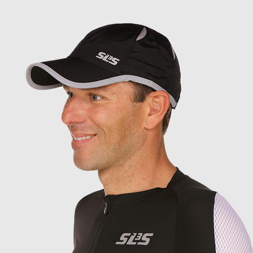 Profile view of a man wearing a black running cap