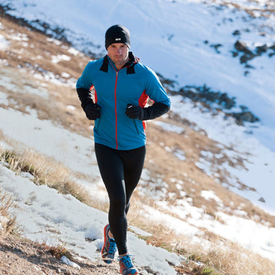 A person running on a snowy hill