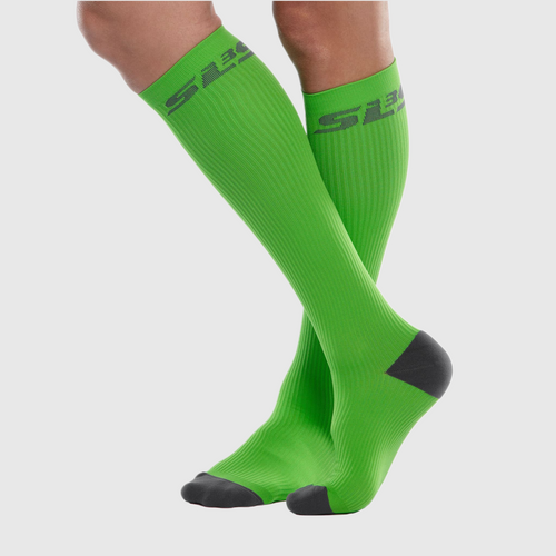 A person wearing green compression socks