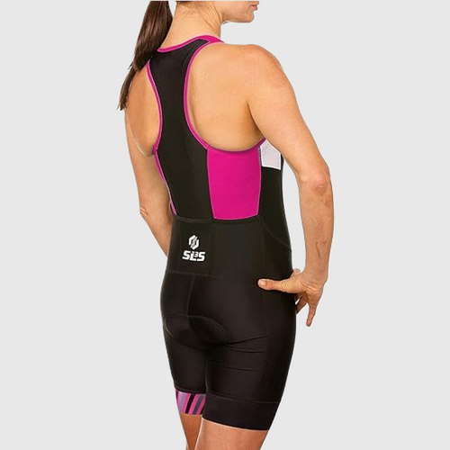 A back view of a woman posing in a black and pink triathlon suit