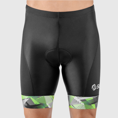 A person wearing black triathlon shorts with green and white geometric pattern