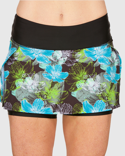 A person wearing a floral print skirt