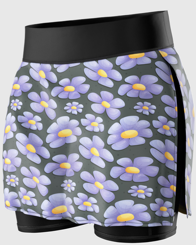 A close-up of a running skirt with purple flower prints on it