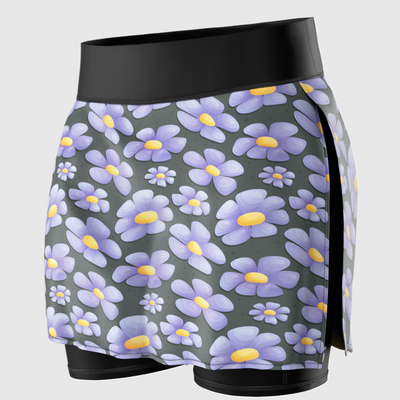 A close-up of a running skirt with purple flower prints on it