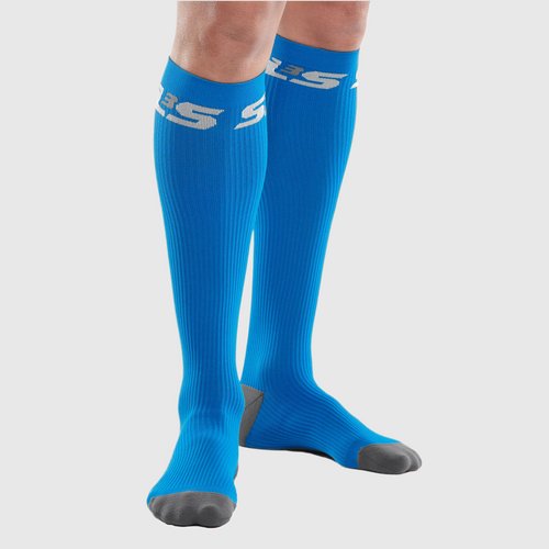 Close-up of a person's leg wearing blue compression socks