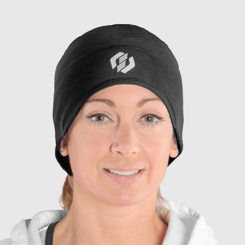 A woman wearing a black ponytail beanie