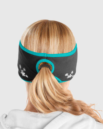 A back view of a woman wearing a black and blue ponytail headband