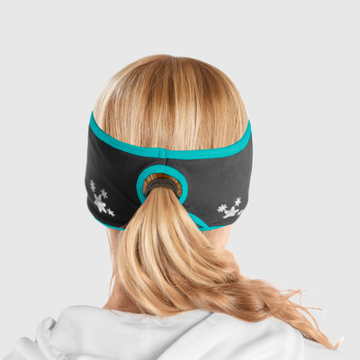 A back view of a woman wearing a black and blue ponytail headband