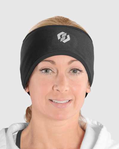 A woman wearing an all black ponytail headband