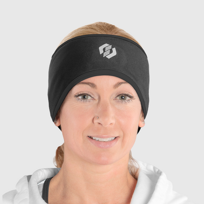 A woman wearing an all black ponytail headband