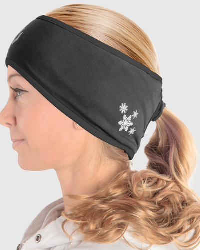 A side view of a woman wearing an all black ponytail headband
