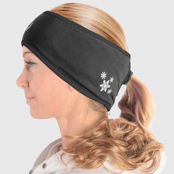 A side view of a woman wearing an all black ponytail headband