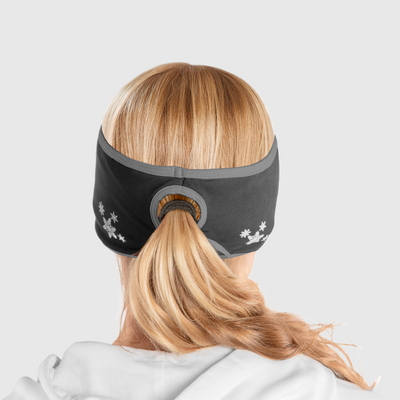 A back view of a woman wearing a black and gray ponytail headband