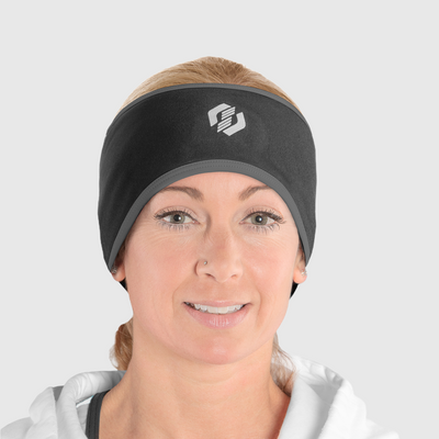 A woman wearing a black and gray ponytail headband