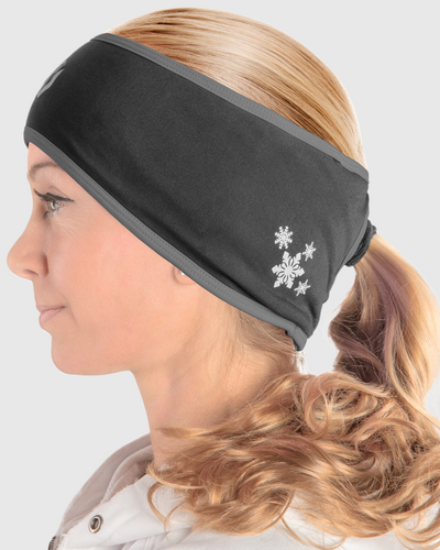 A side view of a woman wearing a black and gray ponytail headband