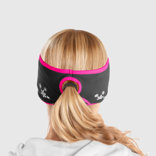 A back view of a woman wearing a black and pink ponytail headband