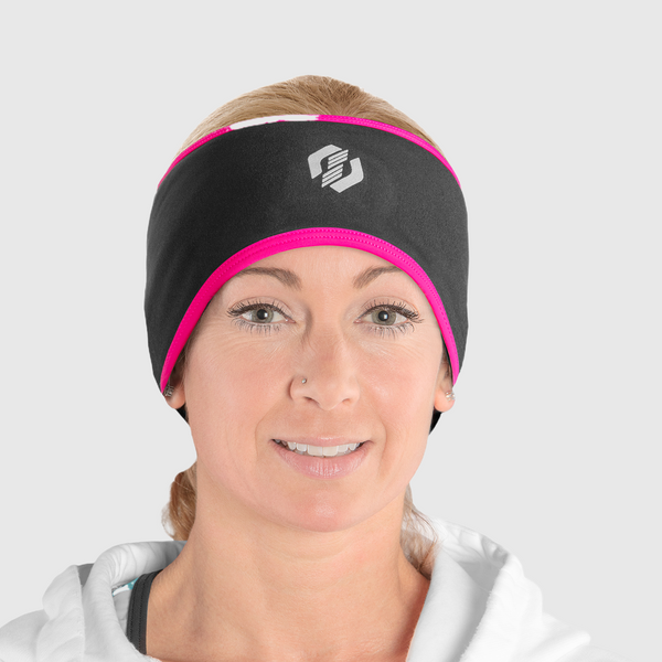 A woman wearing a black and pink ponytail headband