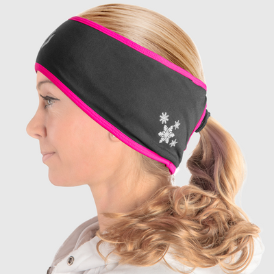 A side view of a woman wearing a black and pink ponytail headband