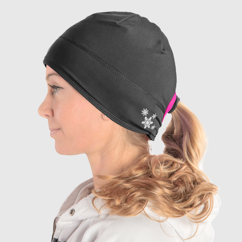 Profile view of a woman wearing a black ponytail beanie with pink accent