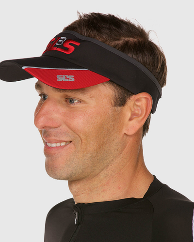 A man wearing a black and red running visor