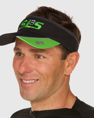 A man wearing a black and green running visor