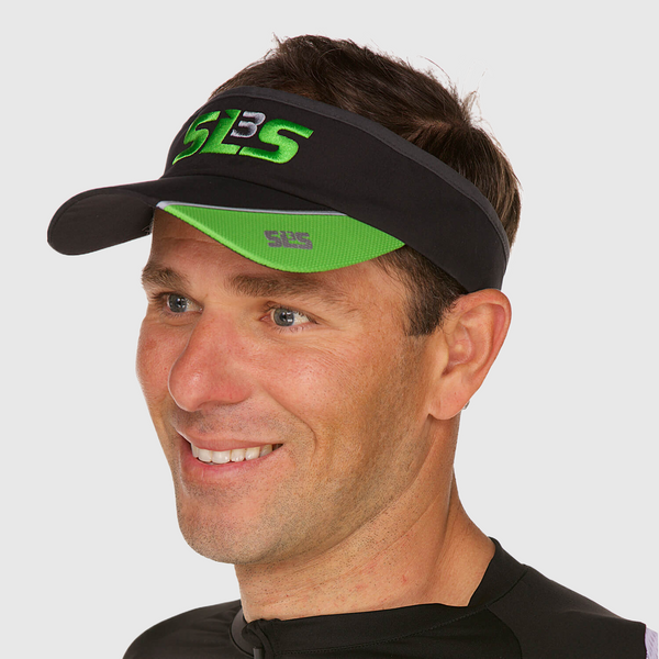 A man wearing a black and green running visor