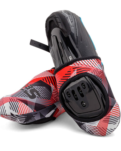 A pair of red, black, and white patterned cycling toe covers