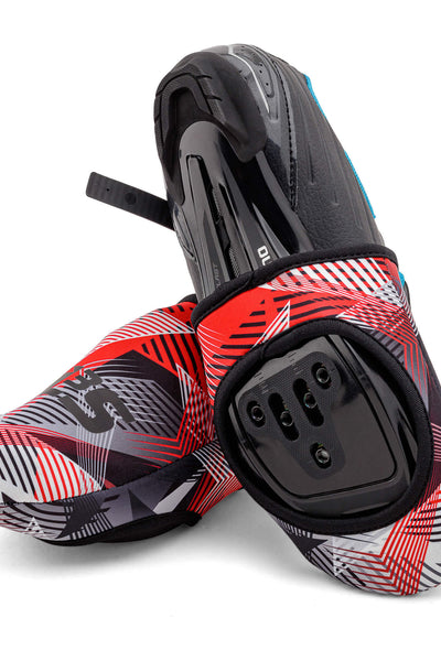 A pair of red, black, and white patterned cycling toe covers