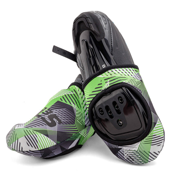 A pair of green and black cycling toe covers with geometric patterns