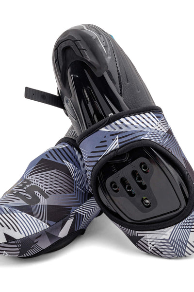 A pair of blue, black, and white patterned cycling toe covers