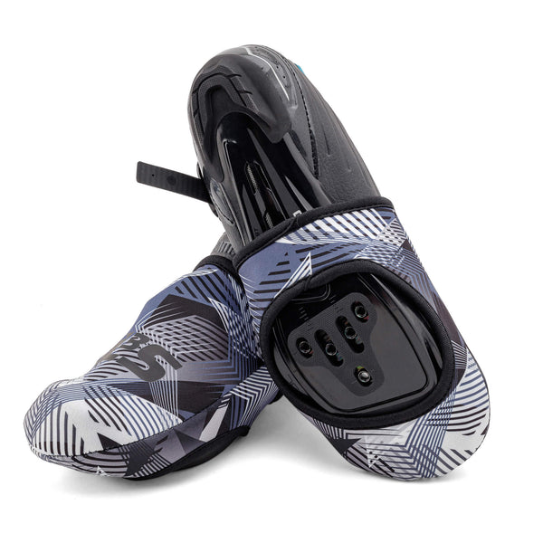 A pair of blue, black, and white patterned cycling toe covers