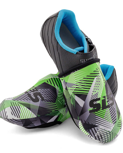 A pair of cycling toe covers with a black and green geometric design